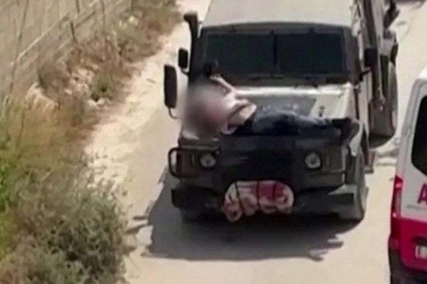 Israeli army strapped wounded Palestinian to jeep