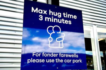 New Zealand airport puts three-minute cap on farewell hugs