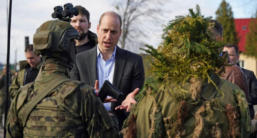 William makes surprise visit to troops in Poland